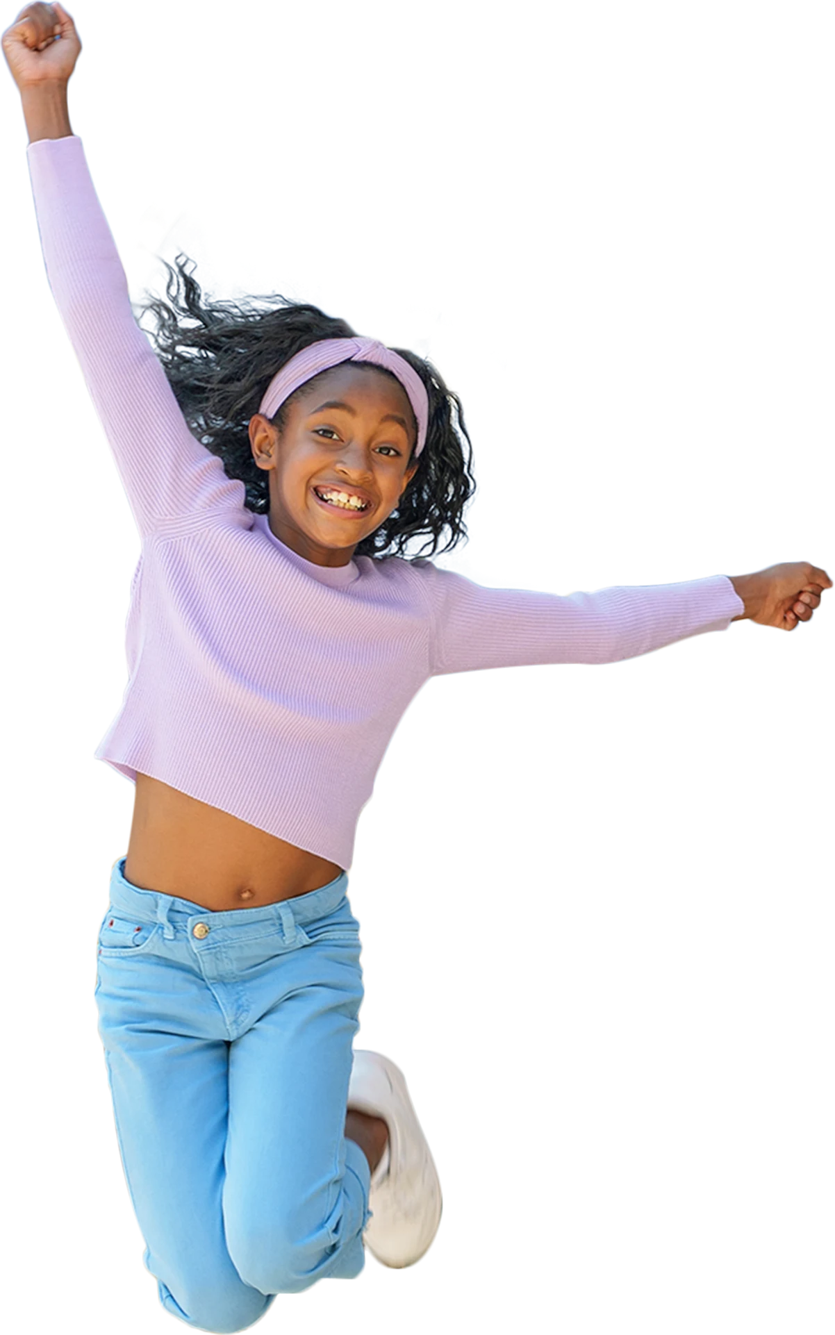A young girl jumping with joy